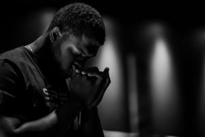 Man Praying With Face to Hands